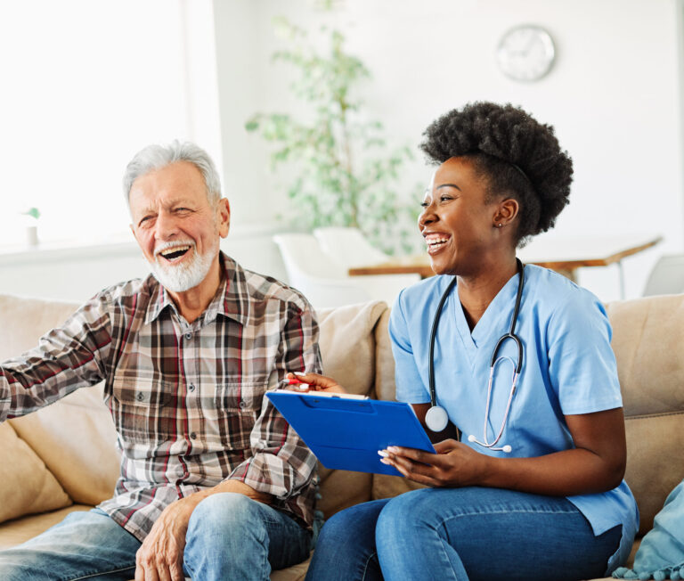 Nurse and senior patient smiling together, medical assistance and caregiving.