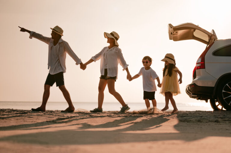 Asian family on beach vacation, travel tips and destination guides