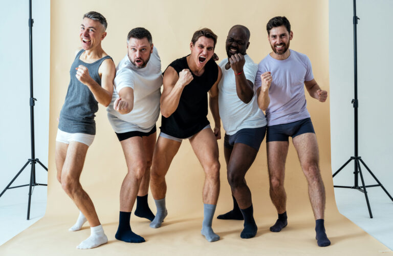Group of multiethnic men posing for a male lifestyle photoshoot and underwear promotion