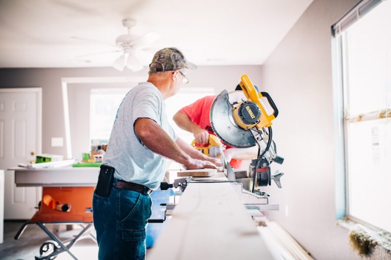 Man using power saw for home improvement project and DIY tasks