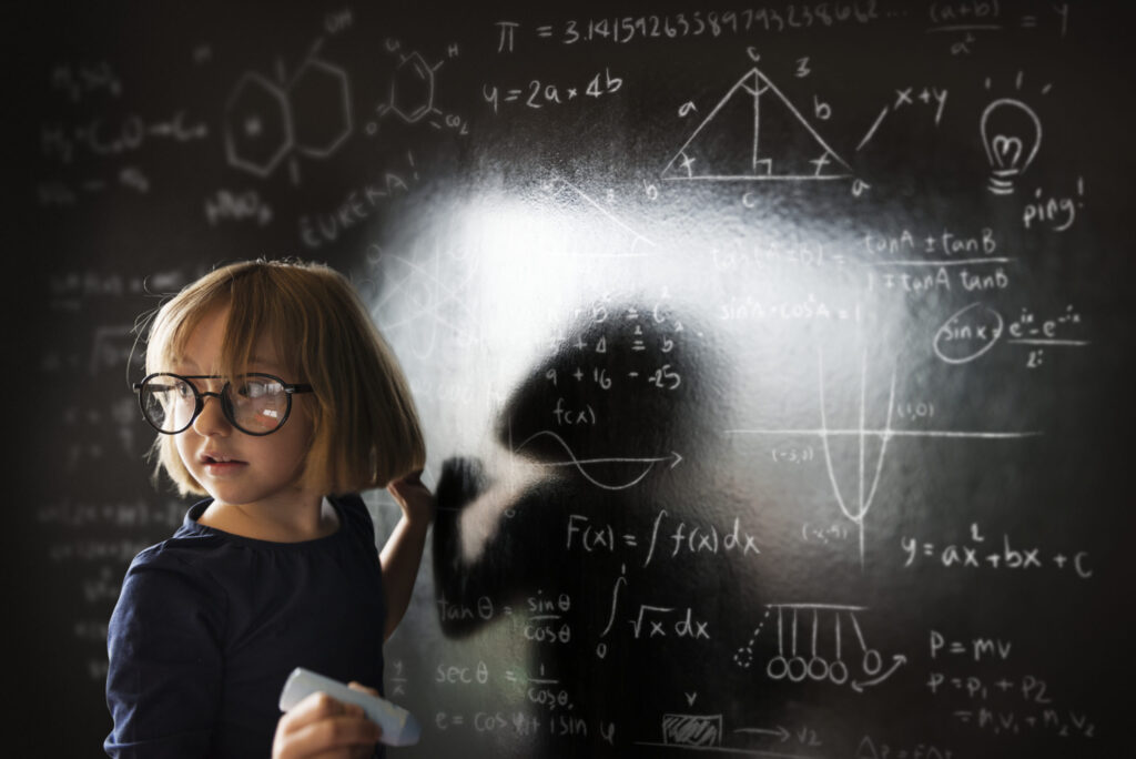 Young student studying science and math equations for academic success.